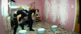 Metal head bangers use their hair to paint a room
